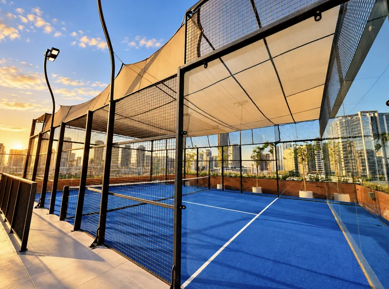 ParkView community rooftop padel court with blue turf and skyline views