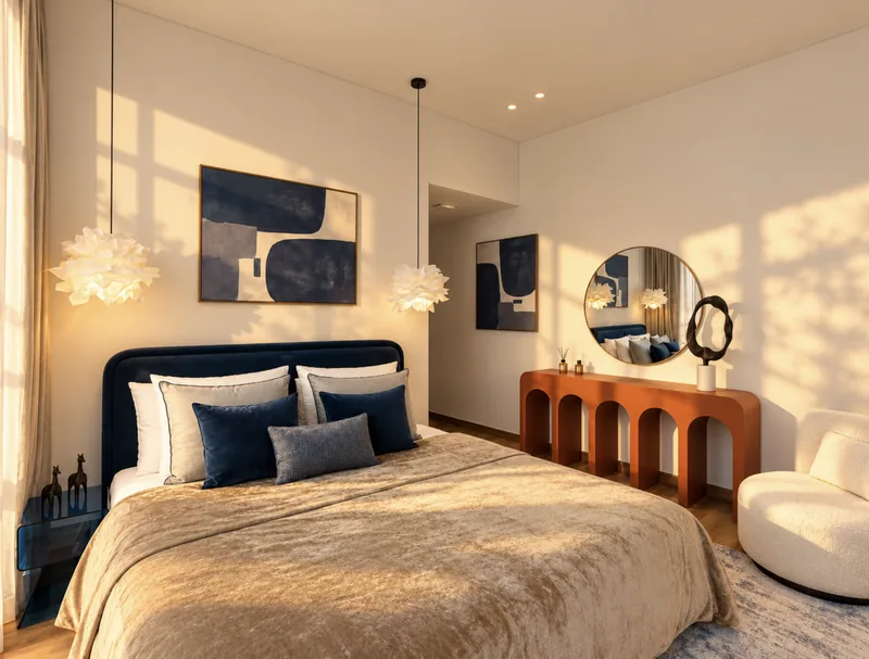 Pearl bedroom with navy headboard, terracotta arched console, round mirror and cloud pendant lights