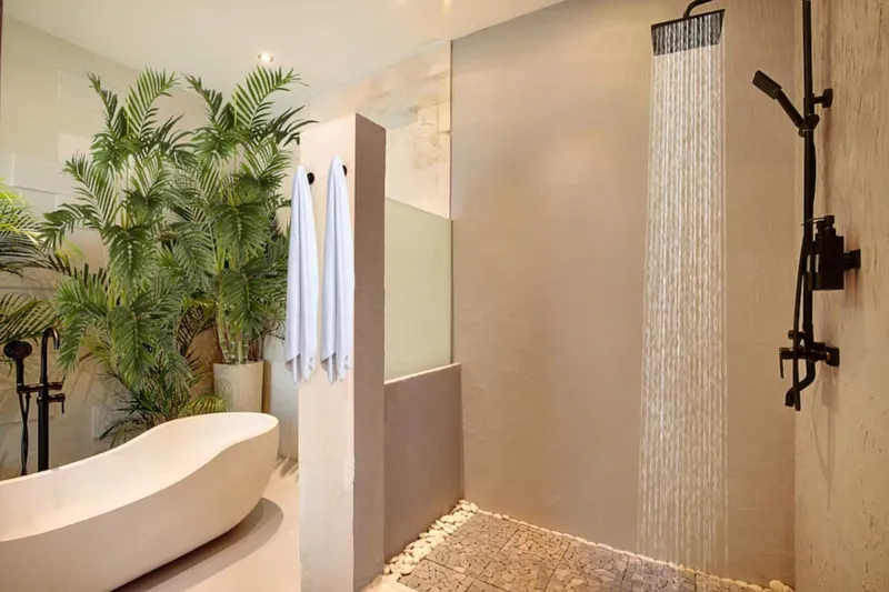 Bathtub and shower combination offers a tranquil escape after a long day.