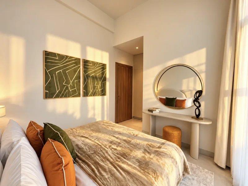 Yasmin bedroom with round mirror, console and abstract green artwork