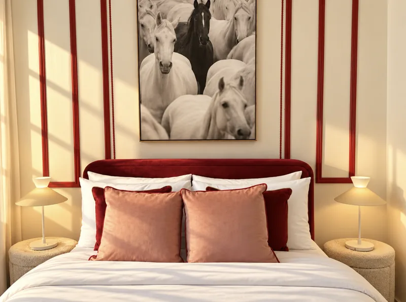 Yasmin bedroom with red headboard and horse artwork